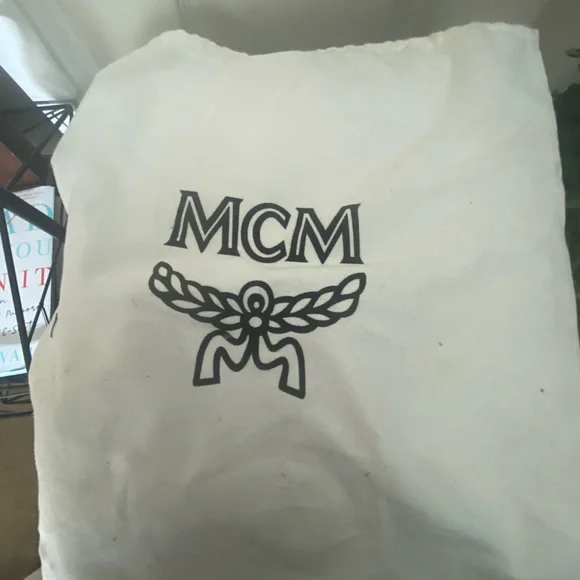 MCM small Cognac back pack with storage bag.